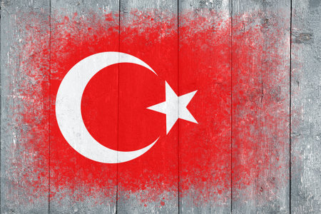 Flag of Turkey. Flag is painted on a gray wooden plank surface. wooden background. Plywood surface. copyspace. textured creative backgroundの写真素材