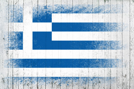 Flag of Greece. Flag is painted on a white wooden surface. wooden background. Plywood surface. copyspace. textured creative backgroundの写真素材