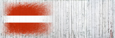 Flag of Latvia. Flag is painted on a white wooden surface. wooden background. Plywood surface. copyspace. textured creative backgroundの写真素材
