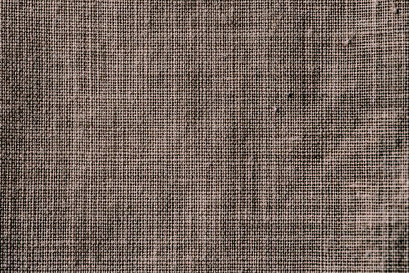 fabric texture. fabric background. Texture of rough brown fabric. Macro image from canvas patternの写真素材