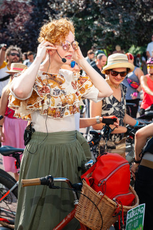 Kyiv, Ukraine - June 27, 2019: Girls' Bike Show-KYIV CYCLE CHIC. Woman organizer near bicycles on a female bike parade. holiday event.のeditorial素材