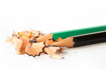 Pencil shavings. Pencils and wooden pencil shavings. Garbage from a sharpener. wooden wasteの写真素材