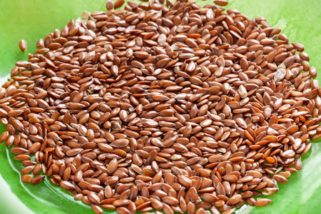 Flax seeds. Flax in a green bowl. Omega 3. Healthy food. top viewの写真素材
