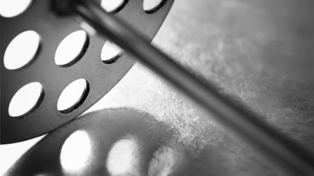kitchen tool. abstract composition. Macro texture of a metal kitchen tool with shallow depth of field. Play of light and shadowsの写真素材