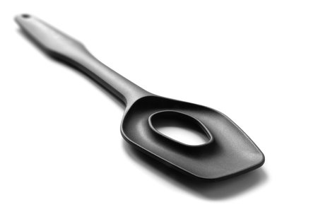 kitchen tools. Black plastic kitchen tool isolated on white background. selective soft focusの写真素材