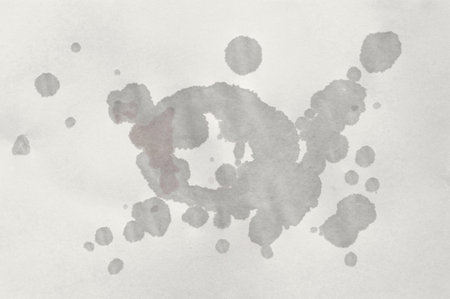 Paper texture with wet spots. Paper with round wet spots of water. Sheet of paperの写真素材