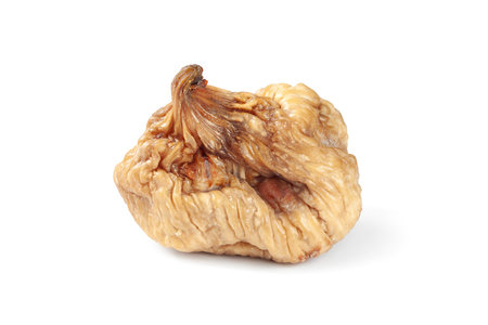 Dried figs. Dry wrinkled figs isolated on white background. One dried fruitの写真素材