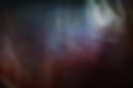 Glare dark surface. Abstract background. Light stains. Defocused glow. Shiny surface. Blurred imageの写真素材