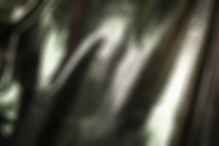 Abstract background. Glaring surface. Light stains. Defocused light. Blurred imageの写真素材