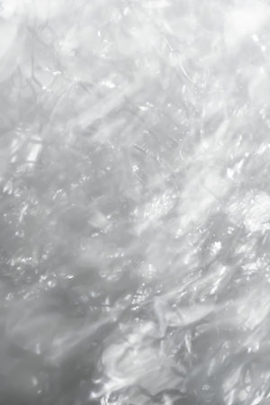 Blurred glitter texture. Abstract background. Glaring surface. Defocused macro imageの写真素材