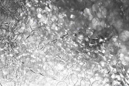 Abstract glare background. Tangled wire close-up. Blurred texture. Macro image. Selective soft focusの写真素材