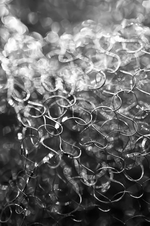 Abstract background. Tangled wire close-up. Blurred glare texture. Macro picture. Selective soft focusの写真素材