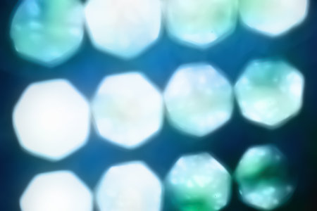 Glare surface. Blurred shiny texture. Abstract background. Blue highlights. Defocused macro imageの写真素材
