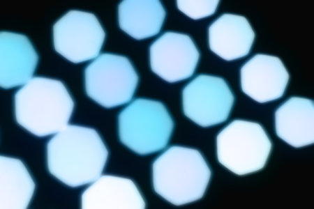 Geometric bokeh. Abstract background. Blurred shiny texture. Glare perspective. Defocused macro imageの写真素材