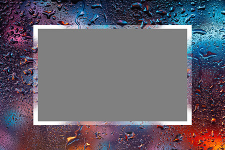 Abstract background. Water drops on glass. Raindrops on the window. Colorful spots. Texture of drops. Selective soft focusの写真素材