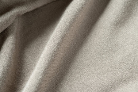 Fabric texture. Natural cotton fabric. Folds in fabric. Detailed background