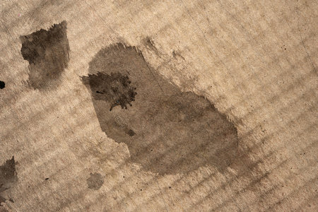 Dirty card stock. Dirty spots on corrugated cardboard. Cardboard texture. Abstract textureの写真素材