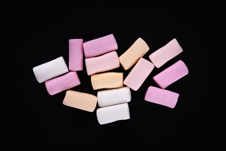 Marshmallow. Heap of colored marshmallows on a dark backgroundの写真素材