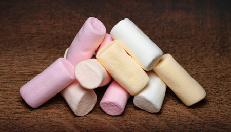 Marshmallow. A pile of mini marshmallows on a wooden surface. Selective soft focusの写真素材