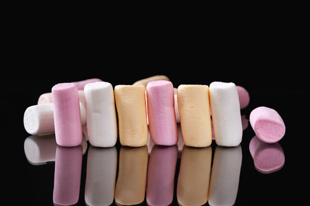 Marshmallow. Heap of marshmallows on a dark backgroundの写真素材