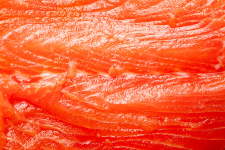 Salmon texture. Texture of fresh salmon fillet close-up. Selective soft focusの写真素材
