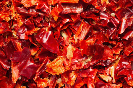 Abstract texture of chopped red pepper close-up. Selective soft focusの写真素材