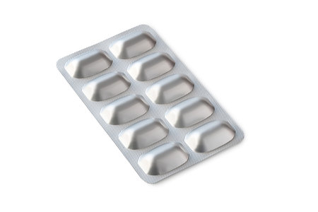 Pills in a blister. Medicine packaging isolated on white background. Medical tabletsの写真素材