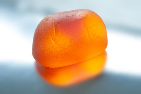 Jelly candies. Orange jelly candy on a shiny background. Close-upの写真素材