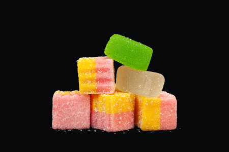 Multicolored marmalade. Jelly candies on a black background. Sweets for allの写真素材