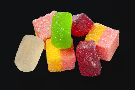Colorful marmalade. Jelly candies on a black background. Sweets for everyoneの写真素材