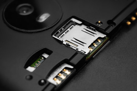 Disassembled smartphone. Close-up of the disassembled gadget with connectors for SIM cards. Selective soft focusの写真素材