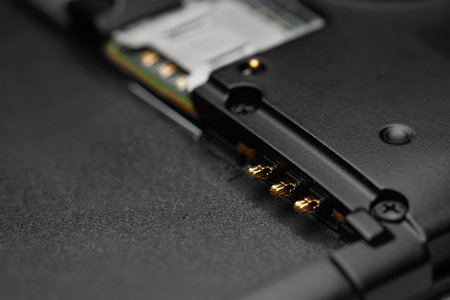 Disassembled smartphone. Close-up of the disassembled gadget with connectors for SIM cards and battery. Selective soft focusの写真素材