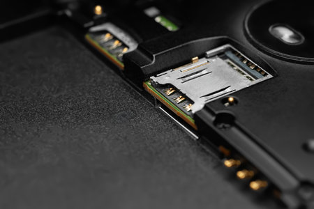 Dismantled smartphone. Close-up of a disassembled gadget with SIM card connectors. Soft focusingの写真素材