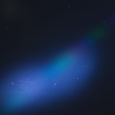 Dust and scratches on the blue screen. Dark abstract background. Vintage effect. Copy spaceの写真素材