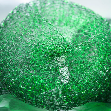 Abstract texture. Colorful metallic abstract. Close up shiny twisted metal wire. Selective soft focusの写真素材