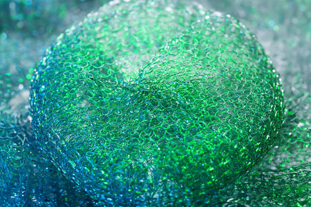 Abstract texture. Colored metallic abstract. Close up shiny twisted metal wire. Selective soft focusの写真素材