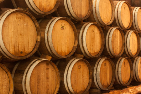 Wooden oak brandy wine grape barrels rows