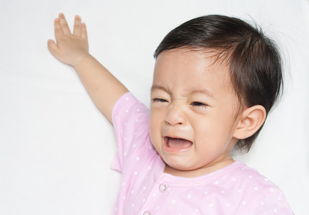 Crying baby on with background isolatedの写真素材