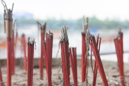 Close up with Burned joss stick in joss stick pot in public Thai templeの写真素材