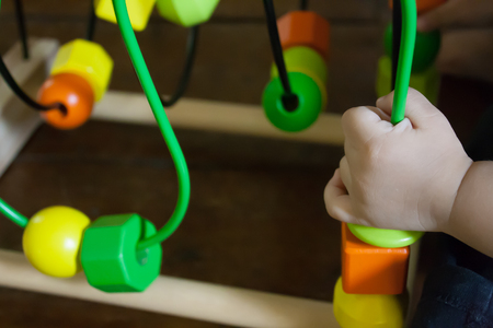 The baby playing with educational toyの写真素材