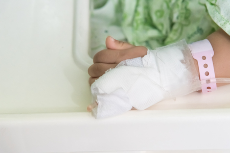 The patient's hand with an intravenous dripの写真素材