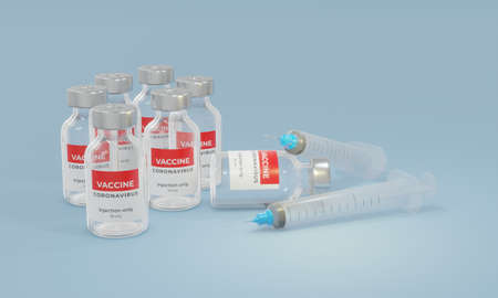 Vials with corona virus vaccine and syringe on light background. Space for text.の写真素材