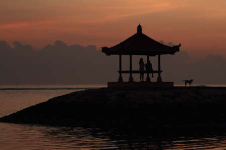 hut sillhoutte at beach in the morningの写真素材