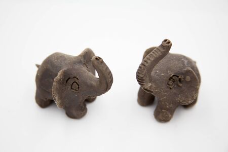Clay figure of two elephants.の写真素材