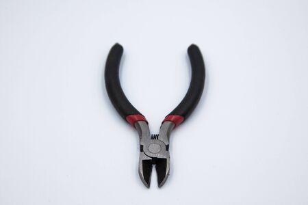 One wire pliers are placed on a white ground.の写真素材