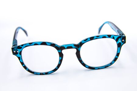 Blue-black eye glasses strap on the ground.の写真素材