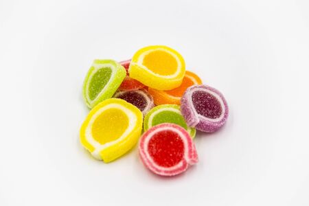 Jellies of many colors coated with sugar were placed together.の写真素材