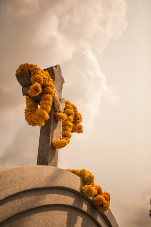 Flowers were brought to pay respect to the cross of the dead.の写真素材