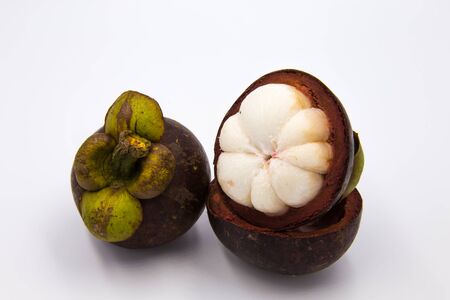 The Mangosteen placed on a white background.の写真素材
