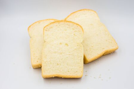Three slices of bread on a white background.の写真素材